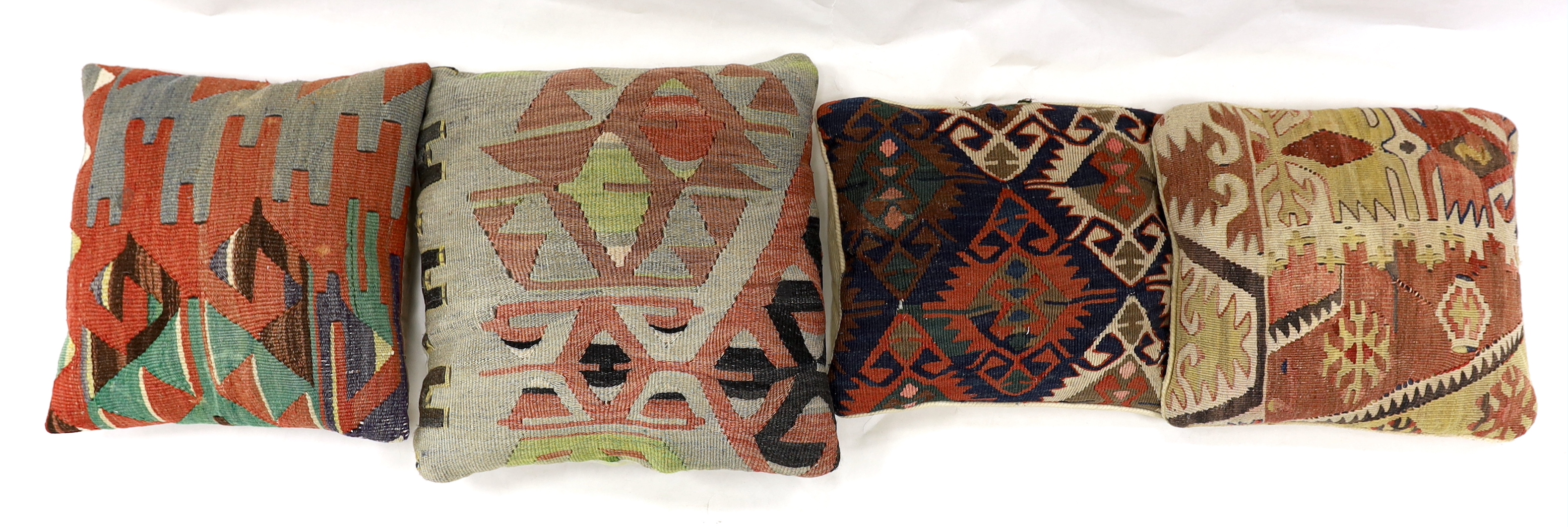 Four Kelim cushions, largest 43cm square